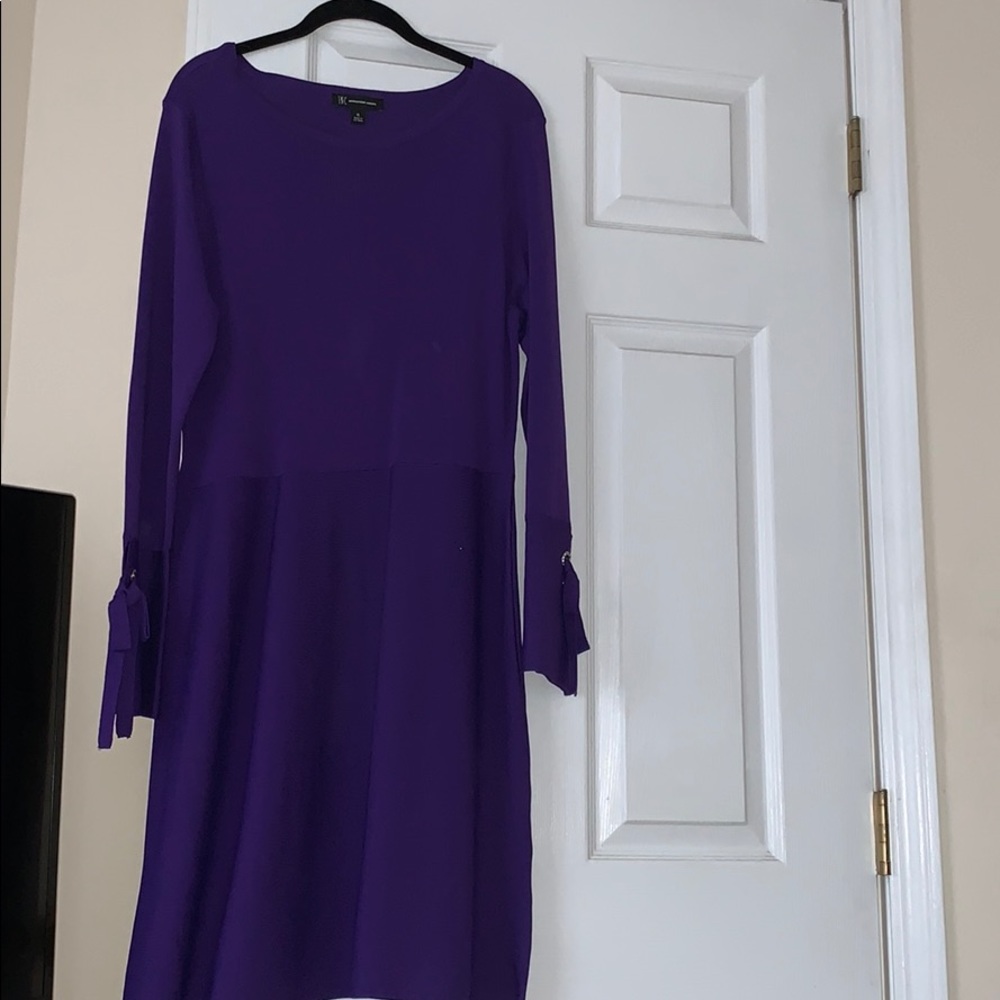Beautiful purple A-line dress with bell sleeves.